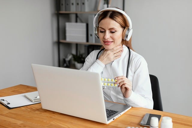 woman holding her sore throat while speaking on a telehealth call